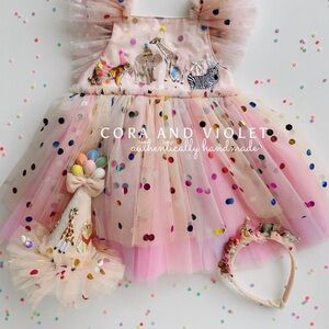 Party animal Cora and Violet first birthday dress with matching headband